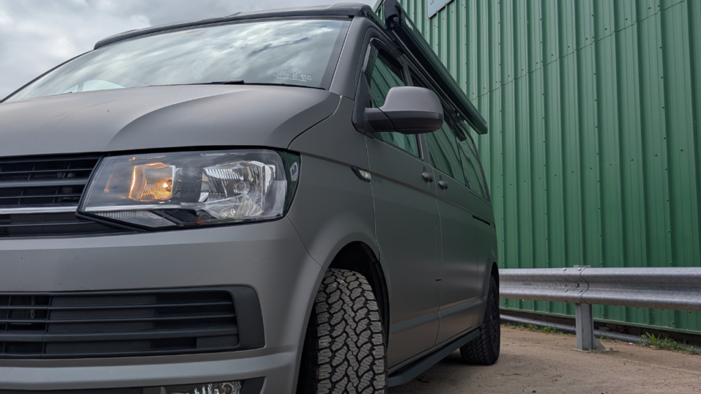 side view of a grey campervan