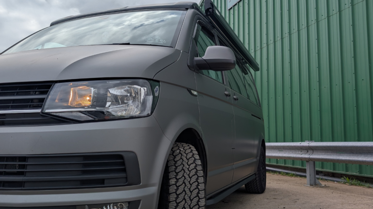 side view of a grey campervan